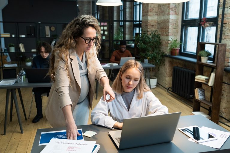 Marketers reviewing SEO tool results on a laptop